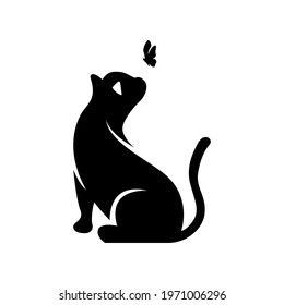 Silhouette of a cat and a flying butterfly above it. vector illustration.