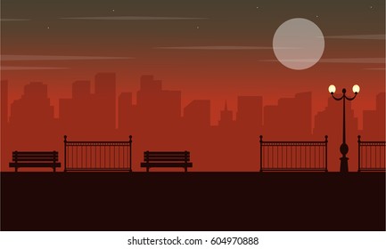 Silhouette of chair on street with city background scenery