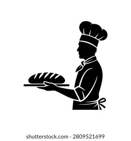 Silhouette of chef holding tray with loaf of bread in kitchen
