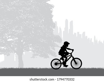 Silhouette of a child on a bike.