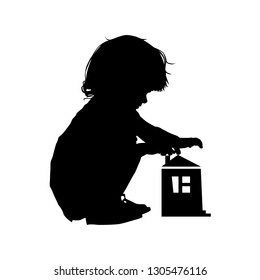 Silhouette of a child sitting playing