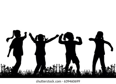 silhouette of children play and dance on grass