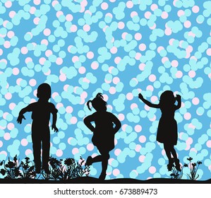 silhouette of children playing on the grass