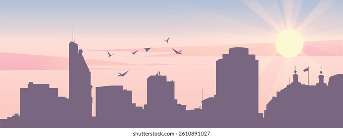 The silhouette of the city against the backdrop of the sunset and pink clouds. It is also made in pastel colors