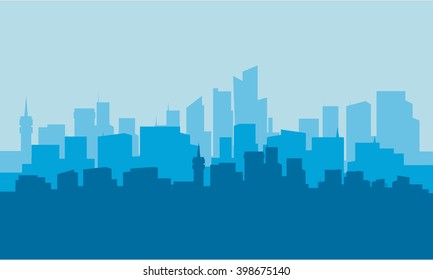 Silhouette of city with blue background at night