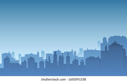 Silhouette of a city in the morning with a bright blue sky.