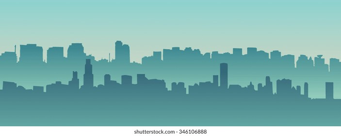 Silhouette of the city at night against the setting sun