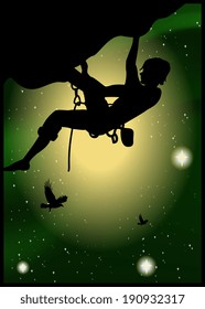 Silhouette of climber at the beautiful starry sky background 