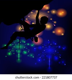 Silhouette of a climber on a background of lights fireworks 