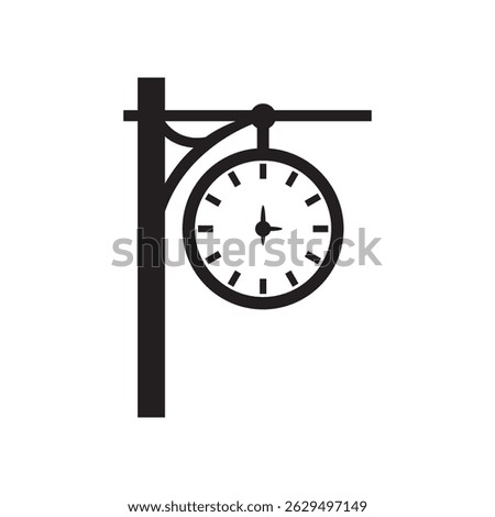 Silhouette of a clock tower at a train station