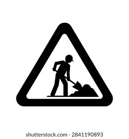 Silhouette of a construction worker digging with a shovel on a roadside warning sign, indicating construction or roadwork zone.