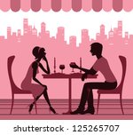 Silhouette of the couple in the cafe