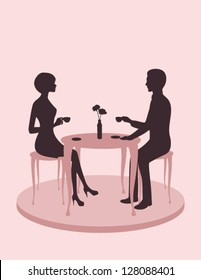 Silhouette of a couple in a cafe