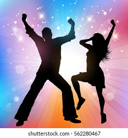 Silhouette of a couple dancing on a starburst background