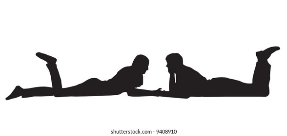 Silhouette of a couple laid down