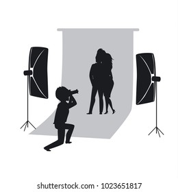 silhouette of couple making photoshoot in photo studio