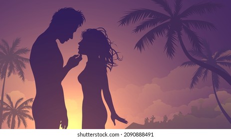 Silhouette of couple man and woman at sunset on a tropical beach