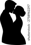 Silhouette of a couple sharing an affectionate embrace and kiss