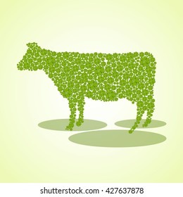 Silhouette of a cow from the leaves of different sizes clover. Vector background