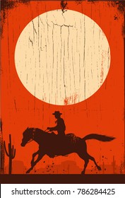 Silhouette of cowboy on running horse on a wooden sign, vector