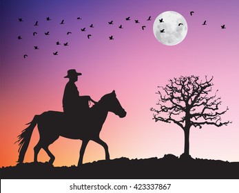 Silhouette of cowboy riding horse to dry tree. Birds flying over the white full moon and tree silhouette in twilight sunset. Wildlife dark shadows in the purple night sky.