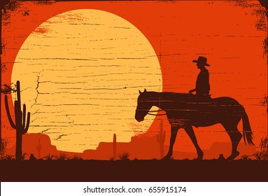 Silhouette of a cowboy riding horse on a wooden board