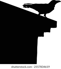 Silhouette of a crow perched on the edge of a building against a clear sky.