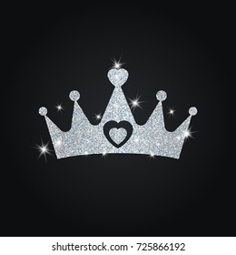 Silhouette of crown with dust glitters. Black background.