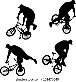 silhouette of cyclist doing bike trick on BMX bicycle