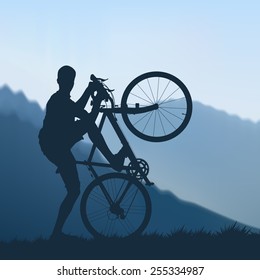 Silhouette of cyclists in the mountains