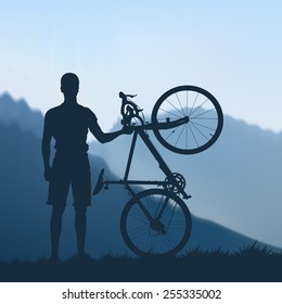 Silhouette of cyclists in the mountains