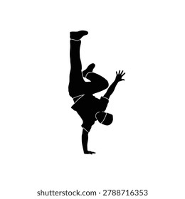 Silhouette of a dancer performing a handstand