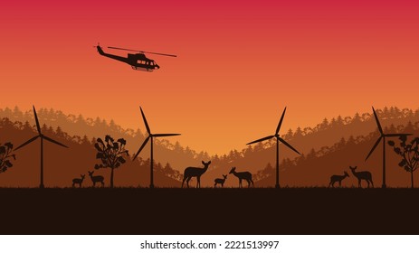 silhouette of deer animal and wind turbine on orange gradient background