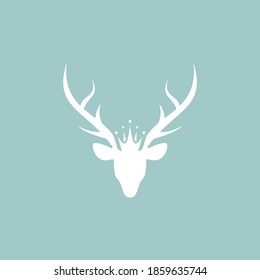 Silhouette of deer head with antlers and royal crown. Monarchy, coat of arms sign. vector flat icon isolated on powder blue background. Magic, fairy tale symbol.