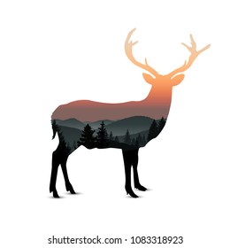 Silhouette of deer with panorama of mountains. Sunset. Mist. 