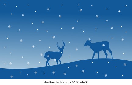 Silhouette of deer with snowfall Christmas scenery