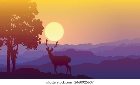 silhouette deer and tree at sunset with beautiful colors