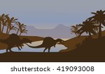 Silhouette of dinosaur in lake at the sunset