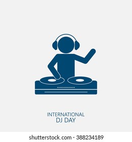 Silhouette of a DJ wearing headphones and scratching a record on the turntable. 