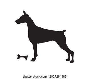 the silhouette of a doberman stands with a bone