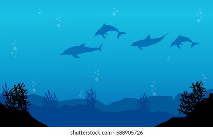 Silhouette of dolphin on blue sea landscape