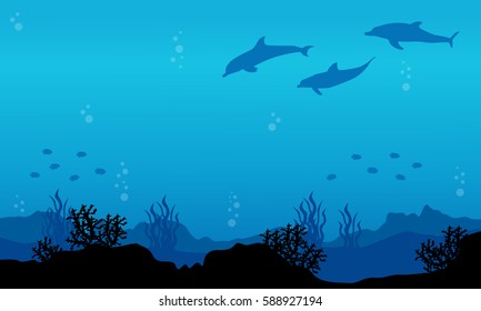 Silhouette of dolphin on underwater landscape