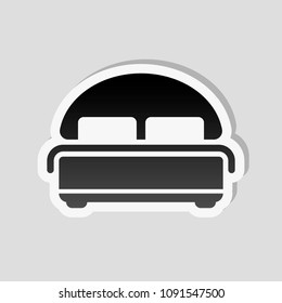 Silhouette of double bed. Double hotel room. Sticker style with white border and simple shadow on gray background