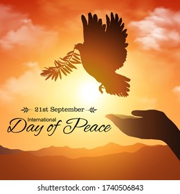 Silhouette of Dove carrying olive leaf branch. Freedom concept and 21st september international day of peace - Vector, illustrator