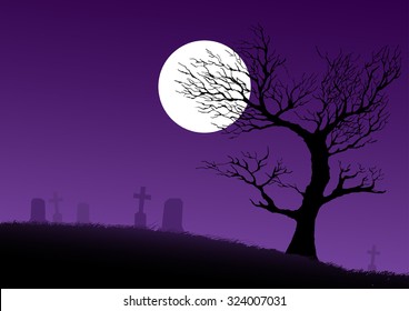 Silhouette of a dried spooky tree on cemetery ground