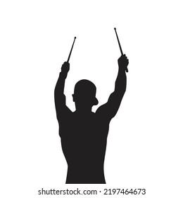 silhouette of a drummer musician holding a drum stick.