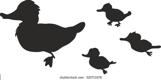 silhouette of duck with ducklings