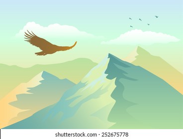 Silhouette of an eagle soaring above mountains