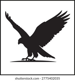 Silhouette of eagle with wings spread wide and talons extended in striking landing pose