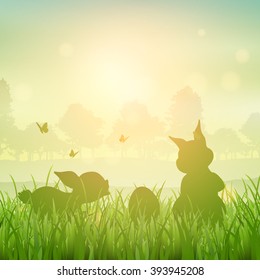 Silhouette of Easter bunnies in a grassy landscape